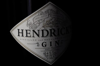 Close-up of a Hendrick's Gin bottle label against a dark background for a premium, sophisticated look.