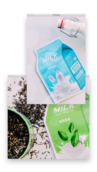 Close-up of milk sheet masks, tea, and a milk bottle on a white surface for skincare and beauty advertising.