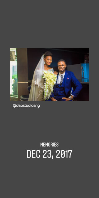 A bride and groom share a happy moment at their indoor wedding celebration.