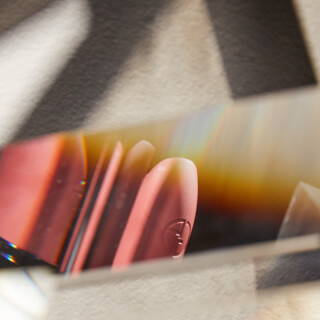 Abstract shot of an eraser through a prism, showcasing light refraction and geometric shapes.