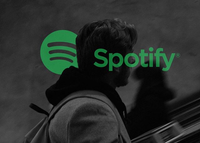 A man with a backpack and Spotify logo overlay, representing modern music streaming and urban lifestyle.
