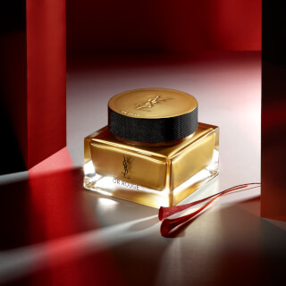Elegant shot of Yves Saint Laurent Or Rouge face cream, showcasing luxury skincare and anti-aging benefits.